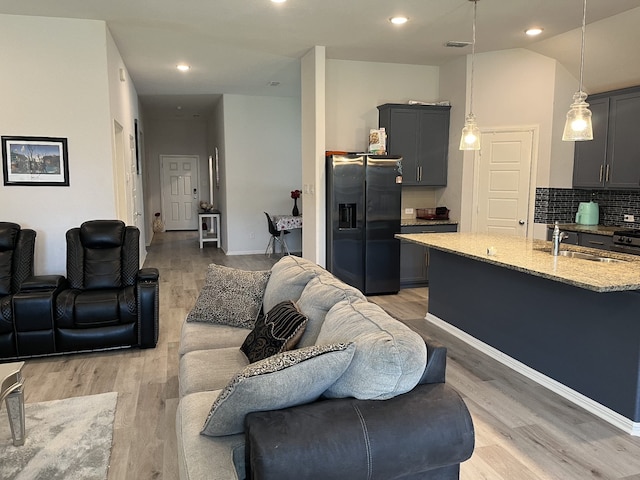 1311 Rosler St, Mansfield, TX 76063 - living area featuring light wood-style flooring, recessed lighting, and baseboards