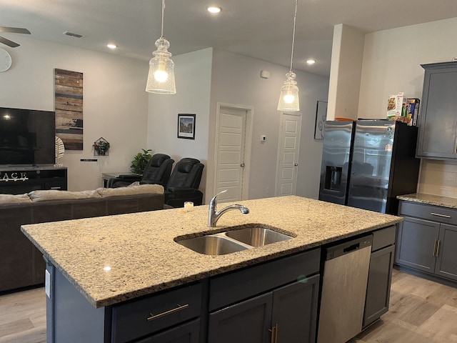 1311 Rosler St, Mansfield, TX 76063 - kitchen featuring stainless steel dishwasher, a sink, refrigerator with ice dispenser, light wood-style floors, and recessed lighting