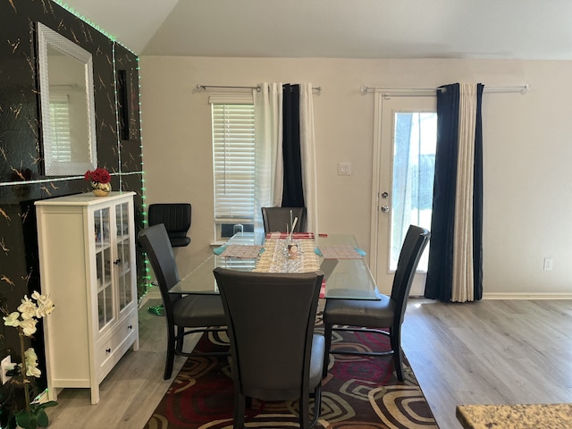 1311 Rosler St, Mansfield, TX 76063 - dining room with light wood-style floors, lofted ceiling, and baseboards