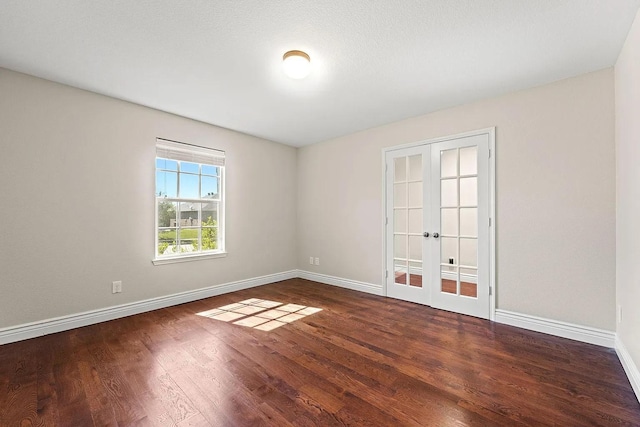 1409 Nicholas Ln, Little Elm, TX 75068 - spare room with french doors, baseboards, and wood finished floors