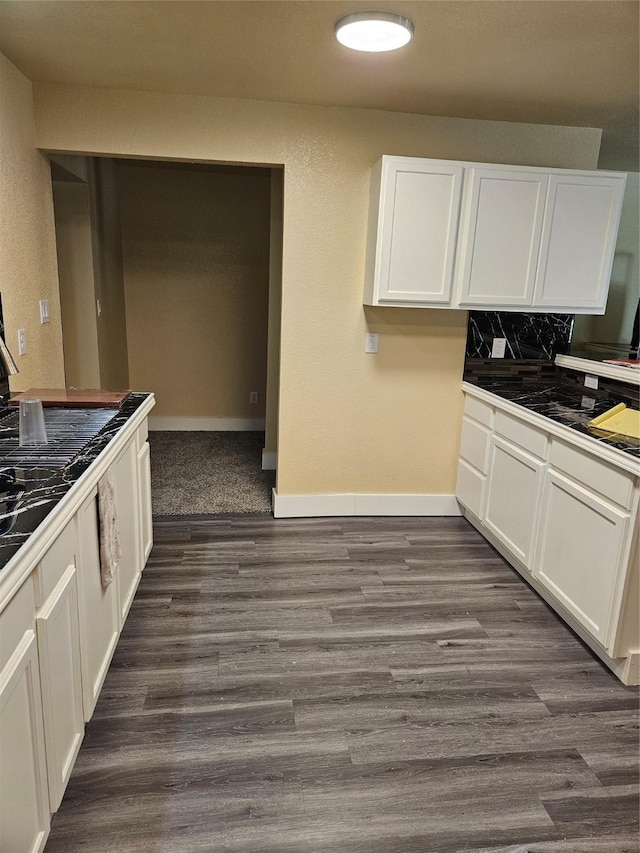 5301 Bonnell Ave, Fort Worth, TX 76107 - kitchen with white cabinetry, dark wood-style floors, baseboards, backsplash, and tile counters