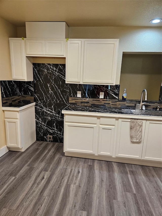 5301 Bonnell Ave, Fort Worth, TX 76107 - kitchen featuring white cabinets, backsplash, wood finished floors, and a sink