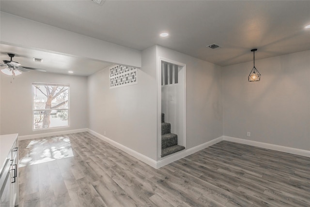 4328 Diaz Ave, Fort Worth, TX 76107 - unfurnished dining area featuring wood finished floors, baseboards, ceiling fan, stairway, and recessed lighting