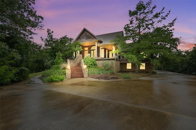 661 Diamond Point Dr, Oak Point, TX 75068 - view of front of house with stairs, a porch, and stone siding