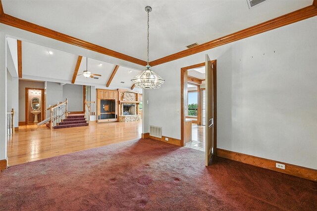 661 Diamond Point Dr, Oak Point, TX 75068 - unfurnished living room with carpet flooring, beam ceiling, a stone fireplace, stairway, and recessed lighting