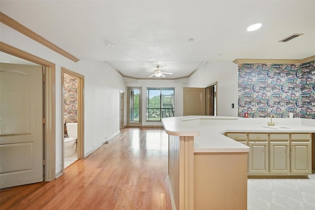 661 Diamond Point Dr, Oak Point, TX 75068 - kitchen with ornamental molding, a ceiling fan, light countertops, light wood-style flooring, and open floor plan