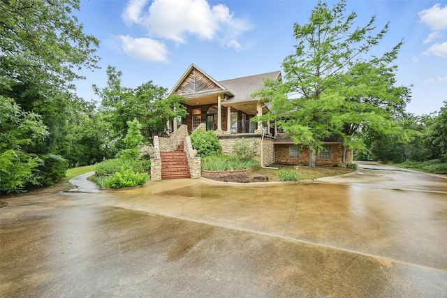 661 Diamond Point Dr, Oak Point, TX 75068 - view of front of property with stairs, a porch, and driveway