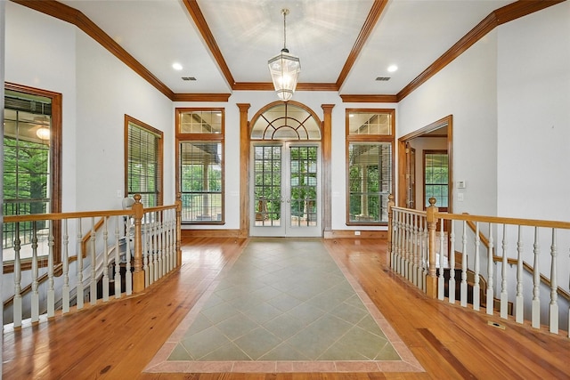 661 Diamond Point Dr, Oak Point, TX 75068 - entrance foyer with healthy amount of natural light, ornamental molding, wood-type flooring, and french doors