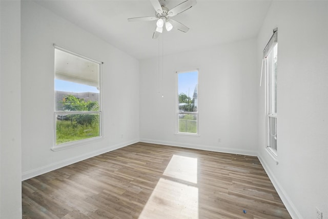 710 W Owing St, Denison, TX 75020 - empty room with wood finished floors and ceiling fan