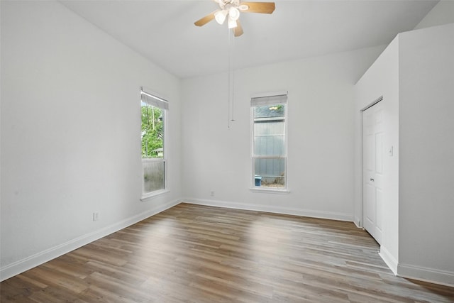 710 W Owing St, Denison, TX 75020 - empty room with a ceiling fan and wood finished floors