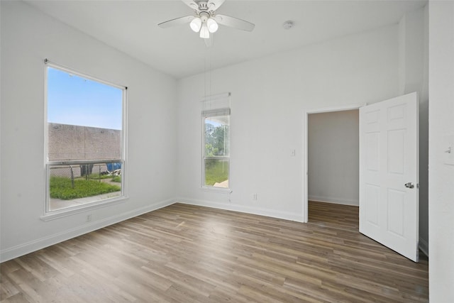 710 W Owing St, Denison, TX 75020 - spare room with wood finished floors, a ceiling fan, and a smoke detector