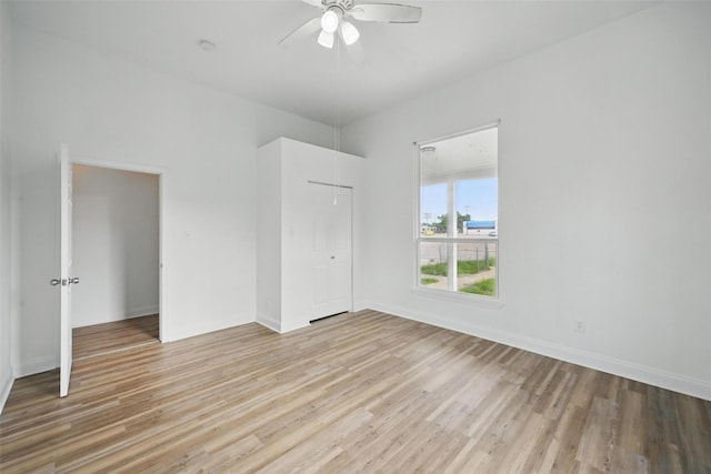710 W Owing St, Denison, TX 75020 - unfurnished bedroom with light wood finished floors, a closet, and a ceiling fan