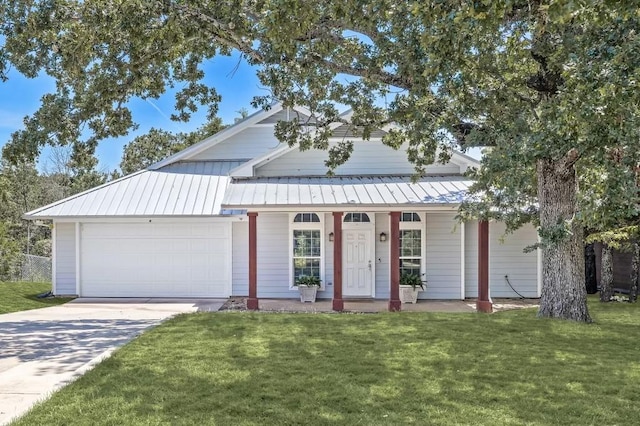 307 Sagebrush Dr, Oak Point, TX 75068 - view of front of home with a porch, a garage, a front lawn, and a standing seam roof