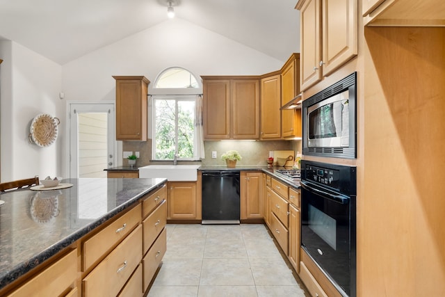 307 Sagebrush Dr, Oak Point, TX 75068 - kitchen with black appliances, a sink, lofted ceiling, backsplash, and dark stone counters