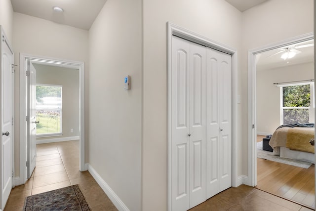 307 Sagebrush Dr, Oak Point, TX 75068 - corridor featuring light tile patterned flooring and baseboards