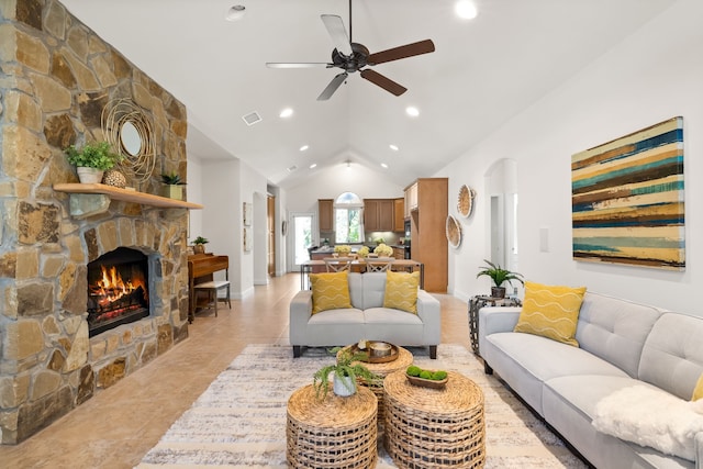 307 Sagebrush Dr, Oak Point, TX 75068 - living room featuring a ceiling fan, a stone fireplace, recessed lighting, light tile patterned floors, and high vaulted ceiling