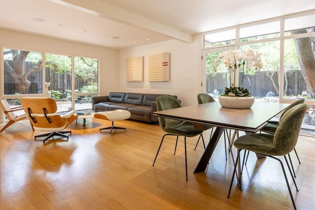4335 Rawlins St, Dallas, TX 75219 - dining space with light wood finished floors and beamed ceiling
