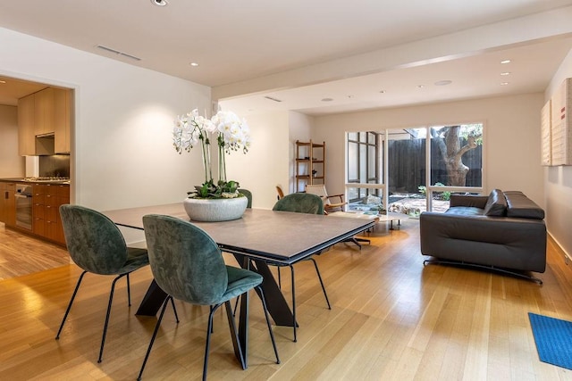 4335 Rawlins St, Dallas, TX 75219 - dining space with light wood-style flooring, recessed lighting, and baseboards