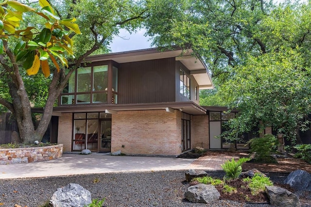 4335 Rawlins St, Dallas, TX 75219 - back of house featuring brick siding