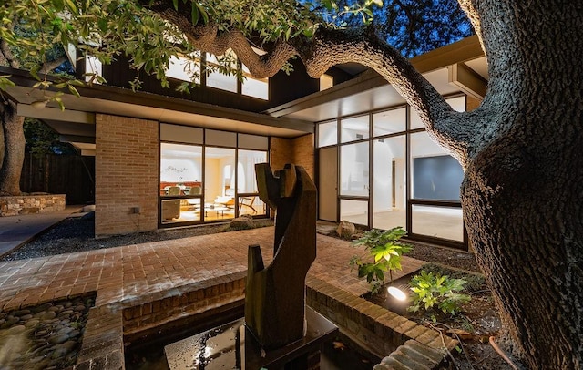 4335 Rawlins St, Dallas, TX 75219 - rear view of property featuring a patio