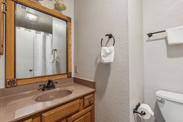 10209 Lone Pine Ln, Fort Worth, TX 76108 - bathroom featuring toilet, vanity, and a textured wall