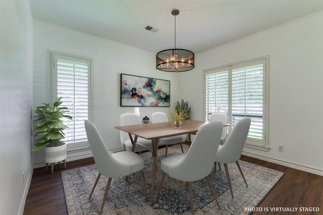 206 Crooked Creek Dr, Richardson, TX 75080 - dining area featuring healthy amount of natural light, a chandelier, and wood finished floors