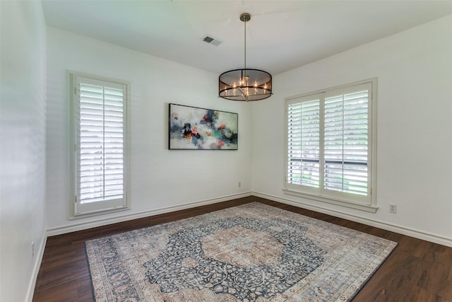 206 Crooked Creek Dr, Richardson, TX 75080 - empty room with dark wood-style flooring and a chandelier