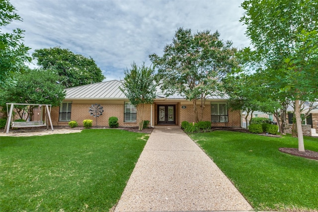 206 Crooked Creek Dr, Richardson, TX 75080 - ranch-style home featuring french doors, a standing seam roof, a front lawn, and brick siding