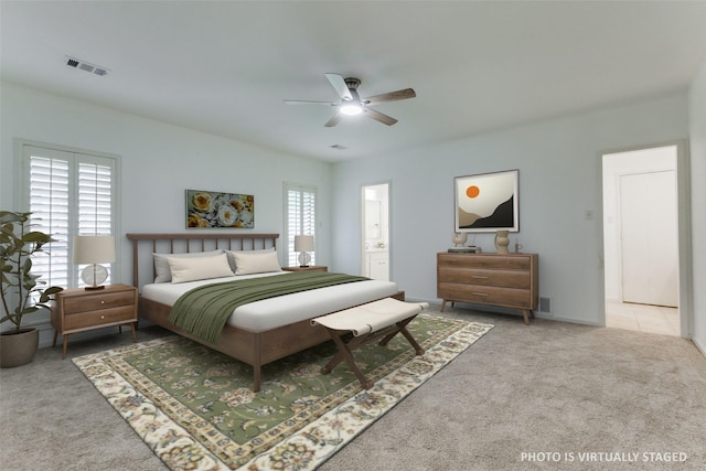 206 Crooked Creek Dr, Richardson, TX 75080 - carpeted bedroom with a ceiling fan and connected bathroom
