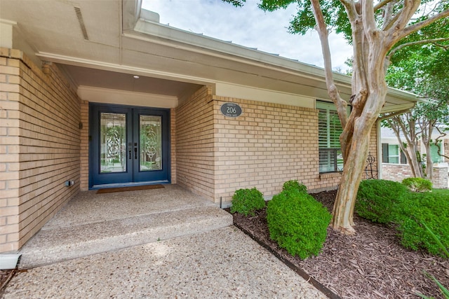 206 Crooked Creek Dr, Richardson, TX 75080 - view of exterior entry with brick siding and french doors
