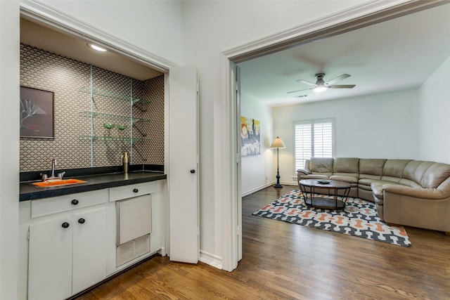 206 Crooked Creek Dr, Richardson, TX 75080 - indoor wet bar with wood finished floors, ceiling fan, and tasteful backsplash