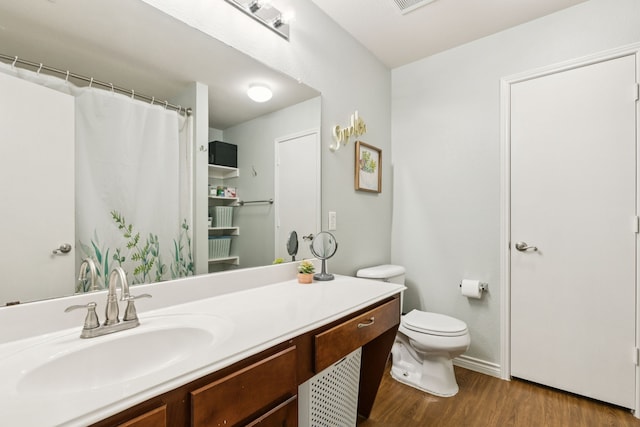 8824 Wagon Trl, Cross Roads, TX 76227 - full bathroom featuring toilet, wood finished floors, and vanity