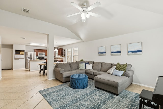 8824 Wagon Trl, Cross Roads, TX 76227 - living area with light tile patterned flooring, ceiling fan, vaulted ceiling, and baseboards