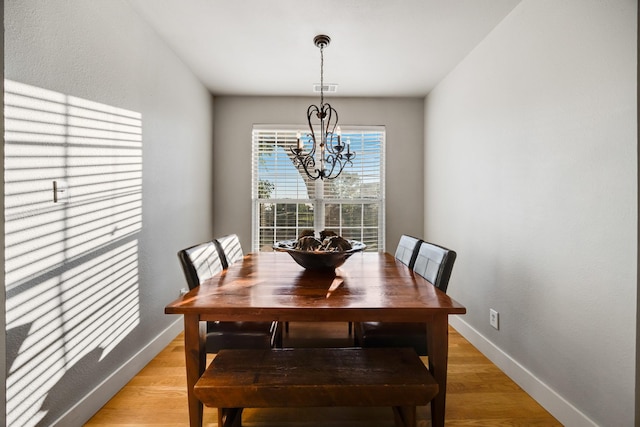 990 Cornelius Rd, Rockwall, TX 75087 - dining area featuring a chandelier, light wood-type flooring, and baseboards