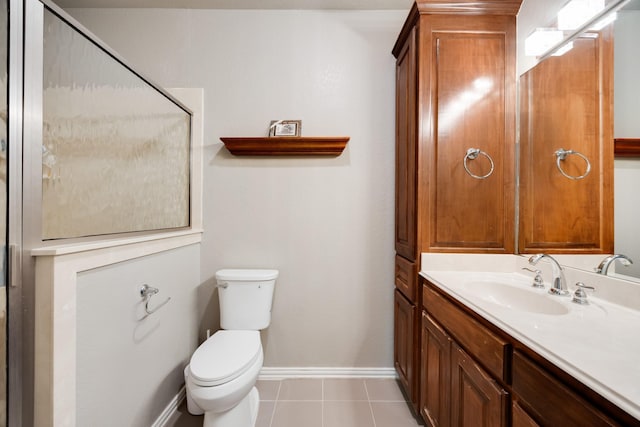 990 Cornelius Rd, Rockwall, TX 75087 - bathroom with toilet, vanity, baseboards, a shower with door, and tile patterned floors