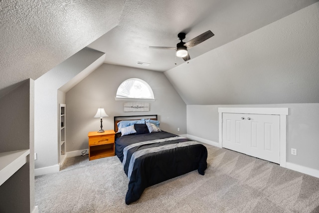 990 Cornelius Rd, Rockwall, TX 75087 - carpeted bedroom featuring vaulted ceiling, baseboards, ceiling fan, and a textured ceiling