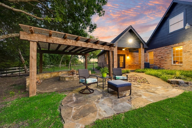 990 Cornelius Rd, Rockwall, TX 75087 - patio terrace at dusk with an outdoor fire pit, a patio area, and a pergola