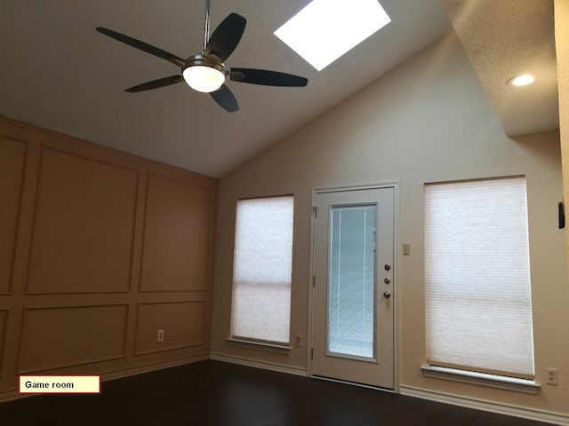 1211 Oriental Ave, Arlington, TX 76011 - doorway with lofted ceiling, a ceiling fan, wood finished floors, and a skylight