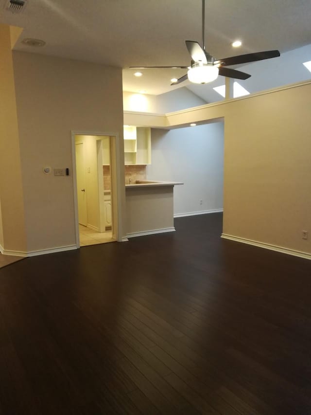 1211 Oriental Ave, Arlington, TX 76011 - unfurnished living room with a ceiling fan, baseboards, dark wood finished floors, and recessed lighting