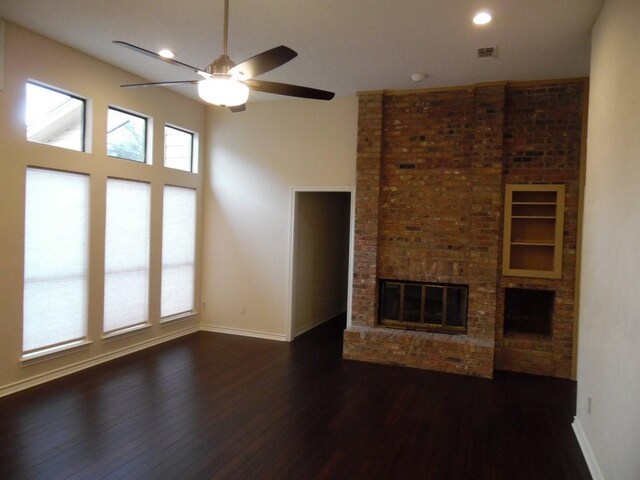1211 Oriental Ave, Arlington, TX 76011 - unfurnished living room featuring dark wood-style flooring, ceiling fan, baseboards, a fireplace, and recessed lighting