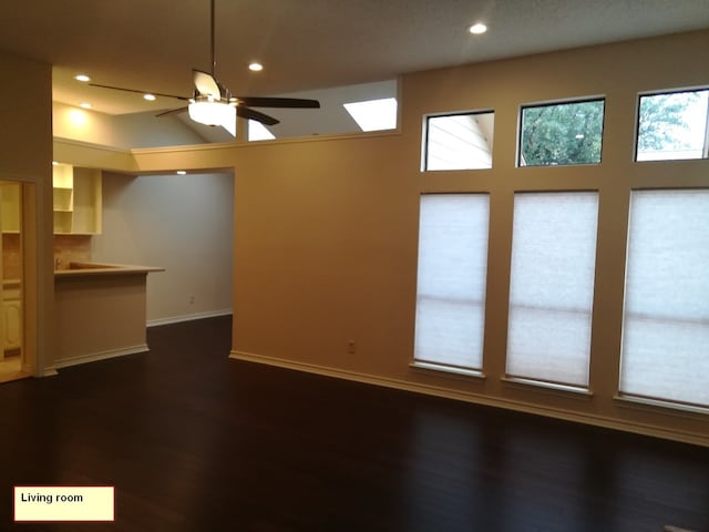 1211 Oriental Ave, Arlington, TX 76011 - unfurnished living room with a ceiling fan, recessed lighting, baseboards, and dark wood-style flooring