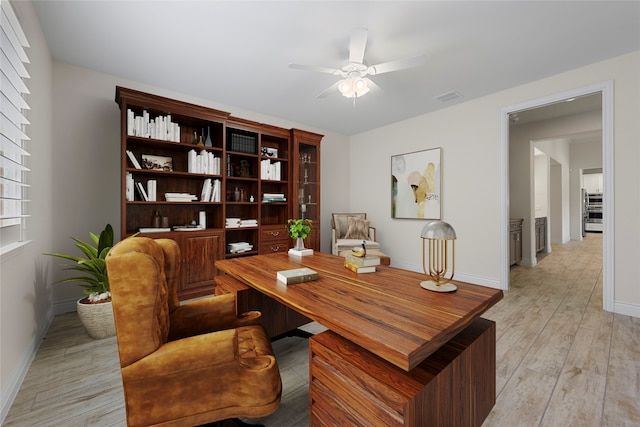 9921 Flint Way, Denton, TX 76207 - home office with ceiling fan, baseboards, and light wood-style floors