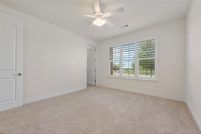 9921 Flint Way, Denton, TX 76207 - empty room featuring light colored carpet, baseboards, and ceiling fan