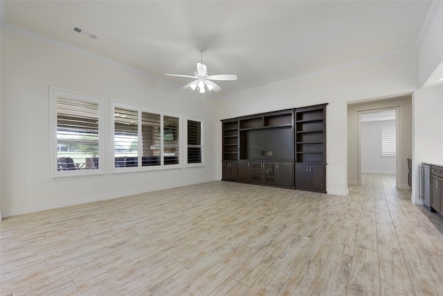 9921 Flint Way, Denton, TX 76207 - unfurnished living room featuring ceiling fan, crown molding, light wood-type flooring, and baseboards