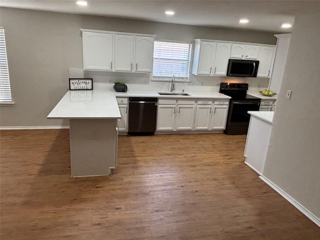 4026 Red Rock Dr, Heartland, TX 75126 - kitchen featuring dishwasher, electric range oven, black microwave, a sink, and a peninsula