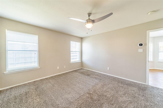 4026 Red Rock Dr, Heartland, TX 75126 - empty room featuring a ceiling fan, plenty of natural light, a smoke detector, and carpet flooring