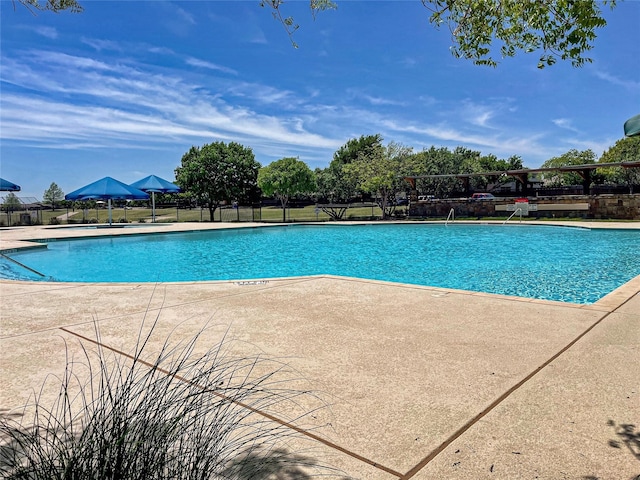 4026 Red Rock Dr, Heartland, TX 75126 - community pool featuring a patio