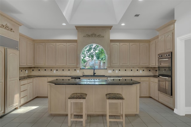 732 Richmond Ln, Keller, TX 76248 - kitchen featuring a sink, light brown cabinets, light tile patterned floors, a center island, and a kitchen bar