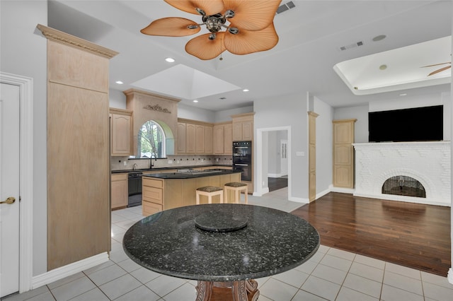 732 Richmond Ln, Keller, TX 76248 - kitchen featuring light brown cabinets, black appliances, a ceiling fan, light tile patterned flooring, and recessed lighting
