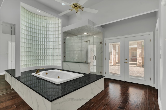 732 Richmond Ln, Keller, TX 76248 - bathroom with french doors, a whirlpool tub, a shower stall, and wood-type flooring